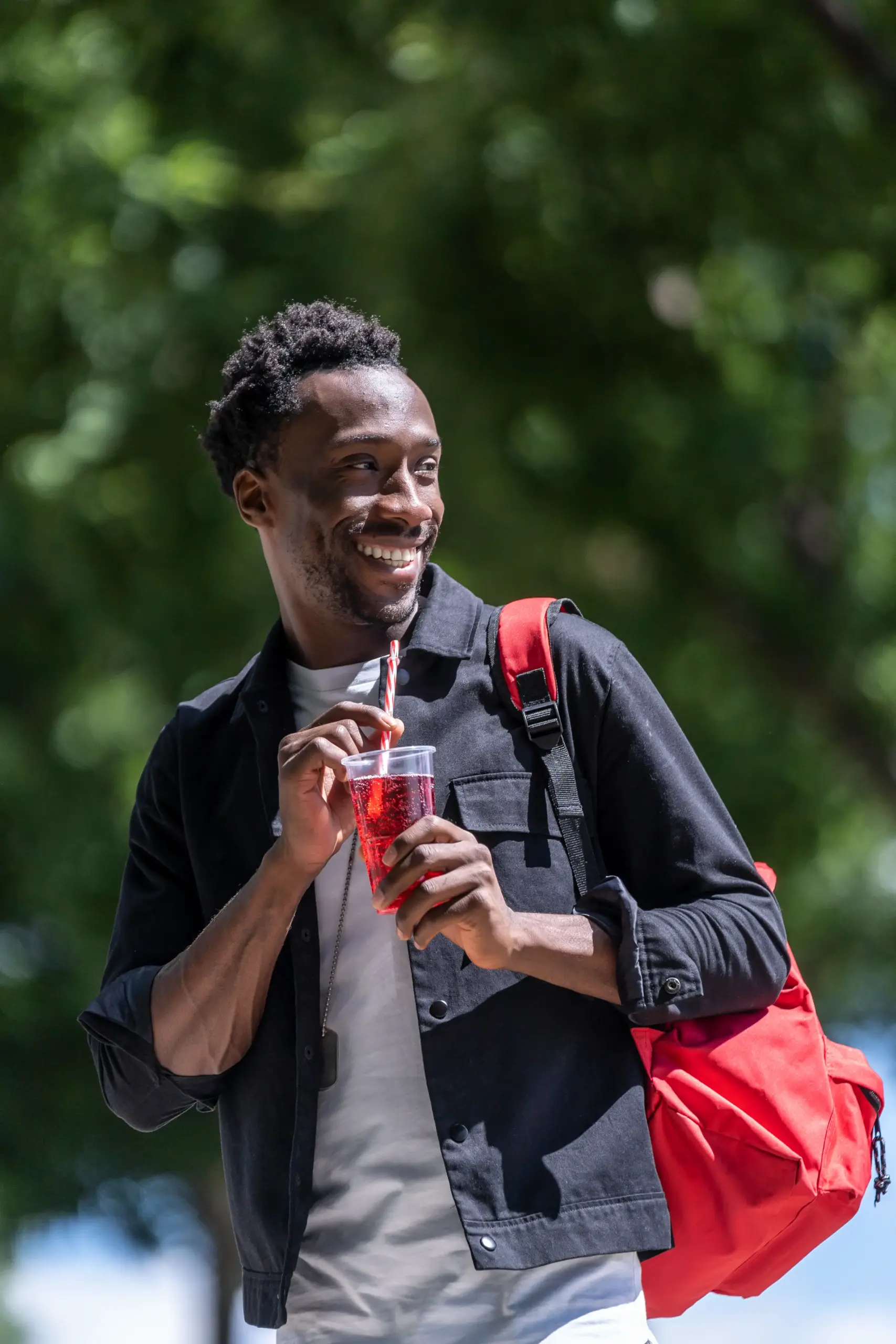 side-view-of-a-man-with-black-skin-drinking-a-soft-2025-01-09-06-14-57-utc